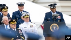 Incoming Joint Chiefs Chairman Gen. C. Q. Brown Jr., speaks during an Armed Forces Farewell Tribute in honor of Joint Chiefs Chairman Gen. Mark Milley, bottom left, Sept. 29, 2023, in Fort Myer, Va.