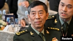 FILE - Li Shangfu in Singapore, June 2, 2023, several months before he was formally dismissed from his post as China's defense minister. China has since expelled nine military officials from parliament in a reshuffle following the appointment of a new defense minister. 