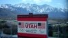 FILE - A scoreboard at the University of Utah promotes Salt Lake City's bid to host another Winter Olympics in 2034 in Salt Lake City, Utah, April 10, 2024. 