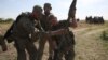 Ukrainian servicemen manipulate a rocket launcher during a training exercise not far from front line in the Donetsk region, June 8, 2023.