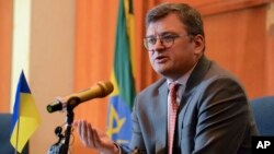 FILE - Ukrainian Foreign Minister Dmytro Kuleba speaks at a press conference at a hotel in Addis Ababa, Ethiopia, May 24, 2023. Kuleba urged African countries to abandon their stances of neutrality toward his country's war with Russia. 