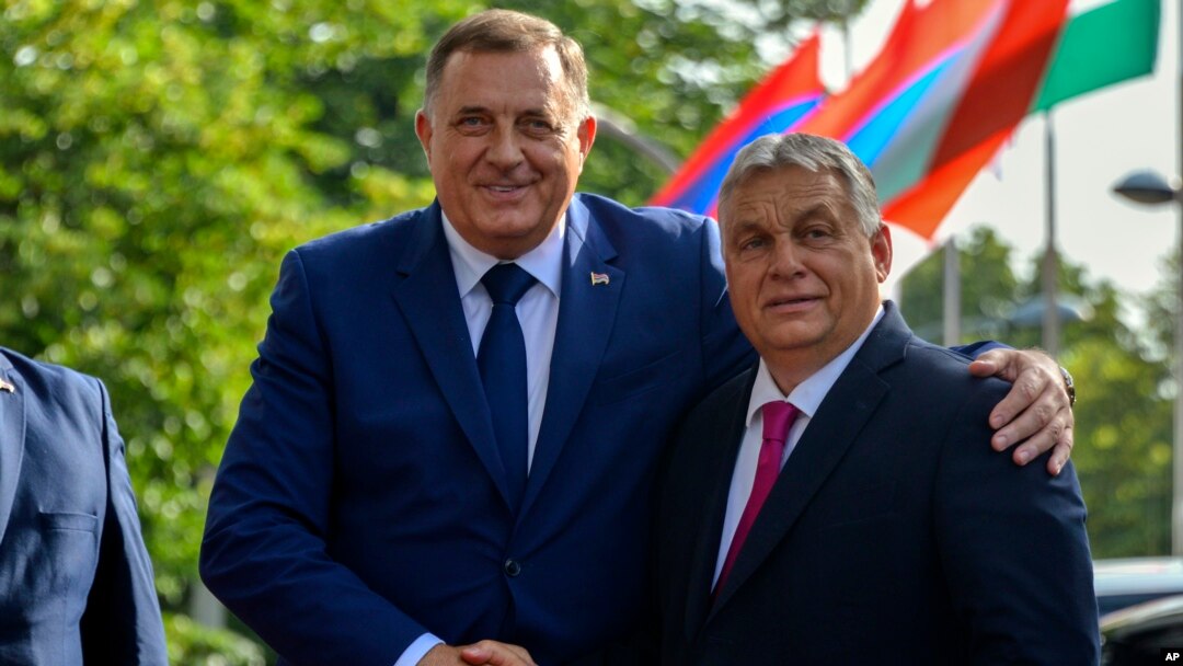 Bosnian Serb leader Milorad Dodik, left, poses with Hungarian Prime Minister Viktor Orban during a welcome ceremony in Banja Luka, Bosnia northwest of Sarajevo, June 22, 2023.