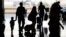 People travel through Salt Lake City International Airport, June 30, 2023, in Salt Lake City. 