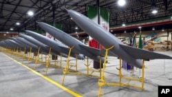 FILE - In this picture released by the official website of the Iranian army on April 20, 2023, Iran-made drones are displayed. The Ministry of Defense said it delivered more than 200 long-range strategic drones to the army. (Iranian army via AP)