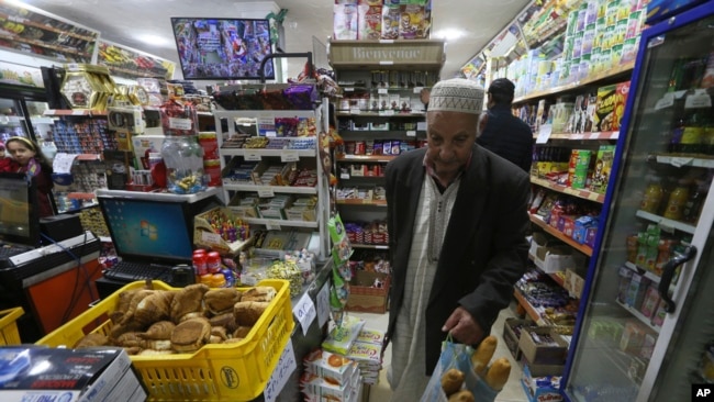 A man shops in a store, Feb. 9, 2024, in Algiers, Algeria.