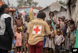 Red Cross officials create awareness around mpox in the Don Bosco refugee camp in Goma, Democratic Republic of Congo, Aug. 22, 2023.