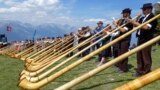 Approximately one hundred Alphorn players perform together on the final day of the 22th International Alphorn Festival on the mountain pasture of Tracouet, 2,200 meters up in the Swiss Alps above Nendaz, July 23, 2023. 
