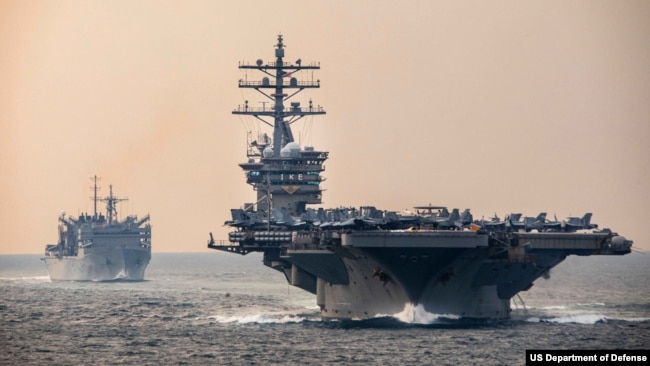 The aircraft carrier USS Dwight D. Eisenhower in the Strait of Hormuz, between the Persian Gulf and the Gulf of Oman, Dec. 14, 2023.