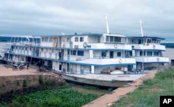 FILE - This undated photo shows a boat named Tombouctou at dock on the Niger River in Mali. Militants attacked the boat on Sept. 7, 2023, killing at least 49 people. (Comanav via AP)