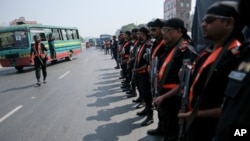 Rapid Action Battalion members patrol along the Dhaka-Chittagong highway during a a three-day blockade called by the Bangladesh Nationalist Party in Dhaka, Bangladesh, Oct.31, 2023. BNP wants a caretaker government to oversee general elections.