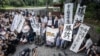 Victims of forced sterilisation under a now-defunct eugenics law, celebrate with lawyers and supporters outside of the Supreme Court of Japan in Tokyo on July 3, 2024. 