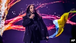 FILE - Ukrainian singer of Crimean Tatar descent Susana Jamaladinova, known under her stage name Jamala, performs "1944," a song with which she won the Eurovision Song Contest in 2016, in Berlin, Germany, March 4, 2022. 