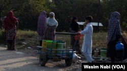 Residents of the Nasirpora area of Budgam district in central Kashmir transport drinking water from a nearby village following the acute water shortage.