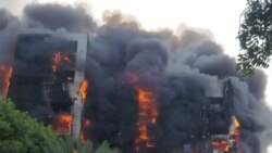 Khartoum Clashes Incinerate Public Buildings [3:24]