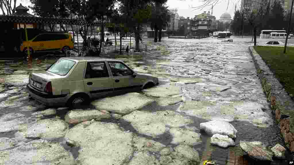 Vehicles are stranded during floods after heavy rains in Antalya, southern Turkey.