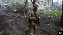 A Ukrainian soldier walks in in Bakhmut, Donetsk region, Ukraine, April 21, 2023. 