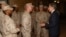 FILE - U.S. Secretary of State Antony Blinken exchanges challenge coins with the U.S. Marine Corps embassy security guard detachment in Baghdad, Iraq on Sunday November 5, 2023. 