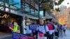 FILE - Chinese migrants protest against Australia's policy shift on the investment visa scheme, as they march outside the Australian Broadcasting Corporation office in Sydney, Australia June 16, 2023.