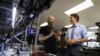 FILE - Canada's Prime Minister Justin Trudeau speaks with Xanadu Quantum Technologies CEO and founder Christian Weedbrook during a visit to the tech firm in Toronto, Jan. 23, 2023. Canada unveiled an immigration initiative to boost its tech workforce. 