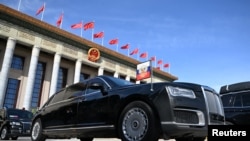 FILE - An Aurus limousine of Russian President Vladimir Putin's motorcade is parked outside the Great Hall of the People during the Belt and Road Forum in Beijing, China, Oct. 18, 2023.