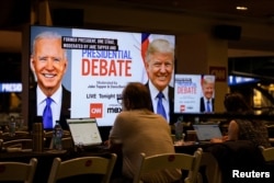 Rais wa Marekani Joe Biden na Rais wa zamani Donald Trump wakiwa katika mdahalo wa CNN.