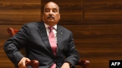 FILE—Mauritania's out-going President Mohamed Ould Abdel Aziz looks on during the swearing-in ceremony of the newly-elected Mauritania's President at a conference center in Nouakchott, on August 1, 2019.