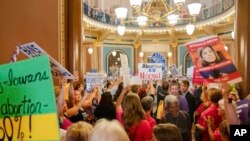 Protestors fill the Iowa State Capitol rotunda, as the Iowa Legislature convenes for special session to legislate the 6-week 'fetal heartbeat' abortion ban, July 11, 2023.