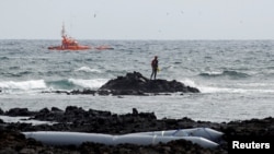 FILE - Rescuers look for bodies after a boat with 46 migrants from the Maghreb region capsized off Orzola, on Lanzarote island, June 18, 2021. Nearly 32,000 migrants have reached the Canary Islands from West Africa in 2023, authorities said Nov. 5, 2023.