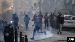 Protesters clash with CRS riot police at the Porte d'Aix in Marseille, southern France on June 30, 2023, over the shooting of a teenage driver by French police in a Paris suburb on June 27.