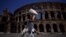 A tourist uses a fan to shelter from the sun near the Colosseum during a heatwave in Rome, July 11, 2023. The beginning of July was Earth's hottest week on record, according to early findings on July 10 from the World Meteorological Organization.