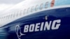 FILE - The Boeing logo is seen on the side of a Boeing 737 MAX at the Farnborough International Airshow in Farnborough, Britain, July 20, 2022. 