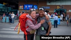 Norwegian climber Kristin Harila, 37, right, and her guide Tenjen Sherpa pose for a photograph in Kathmandu, Nepal, Tuesday, June 6, 2023. (AP Photo/Niranjan Shrestha)