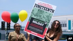FILE: People celebrate Juneteenth, June 19, 2021, in Inglewood, Calif. Communities all over the country will be marking Juneteenth, the day that enslaved Black Americans learned they were free.
