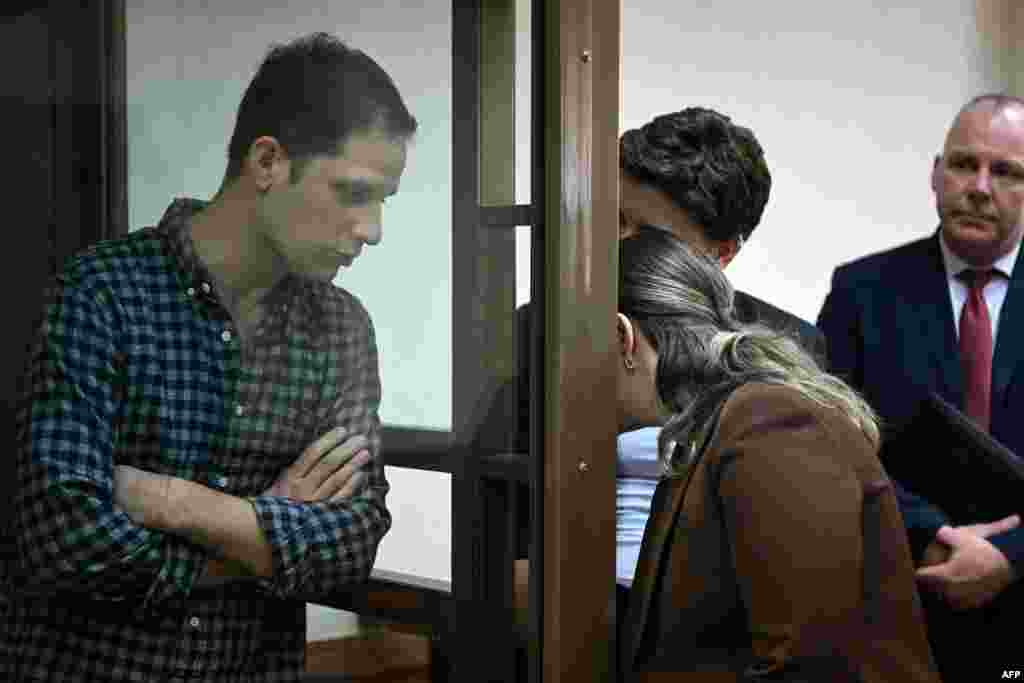 U.S. reporter Evan Gershkovich is seen inside a defendants&#39; cage before a hearing to consider an appeal on his arrest at the Moscow City Court in Moscow, Russia.&nbsp;A Russian court refused to release Gershkovich from jail while he awaits trial on accusations that he spied on Russia while on a reporting assignment last month.