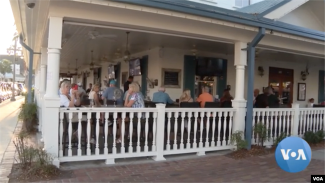 People at The Villages at an establishment at one of the retirement community's town squares, Feb. 27, 2023.