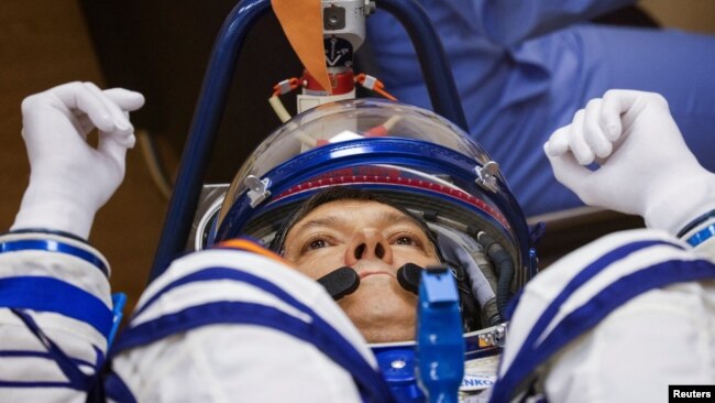 Roscosmos cosmonaut Oleg Kononenko reacts during a check of his space suits before launching to the International Space Station (ISS) at the Russia-leased Baikonur Cosmodrome in Kazakhstan, Sept. 15, 2023.