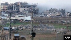 A picture taken in southern Israel near the border with the Gaza Strip on December 24, 2023, shows Israeli army bulldozers rolling into the Palestinian enclave amid continuing battles between Israel and the militant group Hamas.