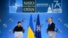 Ukraine's President Volodymyr Zelenskyy and NATO Secretary-General Jens Stoltenberg speak during a press conference at the NATO summit in Washington, July 11, 2024. 