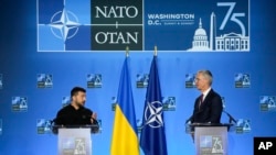 Ukraine's President Volodymyr Zelenskyy and NATO Secretary-General Jens Stoltenberg speak during a press conference at the NATO summit in Washington, July 11, 2024. 