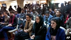 FILE - Afghan journalists attend a press conference in Kabul, Afghanistan, Feb. 13, 2022. 