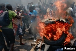 People protest against Western partners in front of the U.S. embassy in downtown Kinshasa, Democratic Republic of Congo, Feb. 12, 2024.