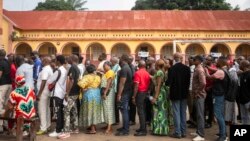 Voters queue outside a polling station during the presidential elections in Kinshasa, Democratic Republic of the Congo, Dec. 20, 2023.