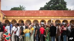 FILE - Voters queue outside a polling station during the presidential elections in Kinshasa, Democratic Republic of the Congo, December 20, 2023.