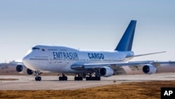 FILE - A Boeing 747, operated by Venezuela's state-owned Emtrasur cargo line, taxis on the runway in Cordoba, Argentina, June 6, 2022. 