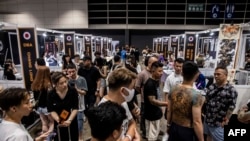 People attend the 7th Hong Kong China International Tattoo Convention in Hong Kong, Aug. 25, 2023. There are hundreds of tattoo studios in the city, and with the Year of the Dragon fast approaching, dragons are in demand.