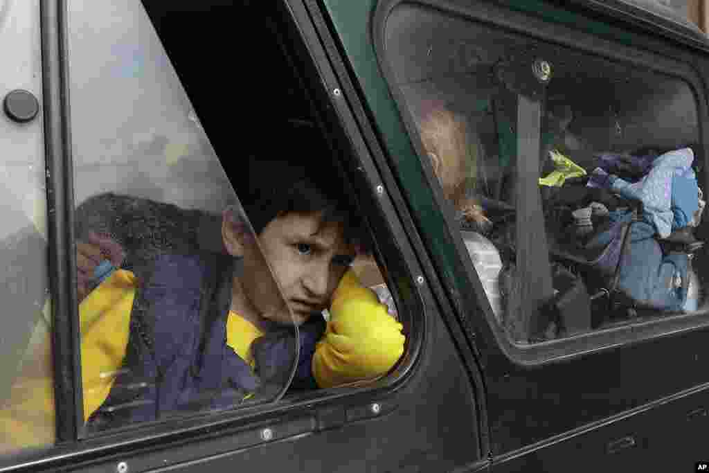 An ethnic Armenian boy from Nagorno-Karabakh looks on from a car upon arrival in Armenia&#39;s Goris, the town in Syunik region, Armenia.&nbsp;Thousands of Armenians have streamed out of Nagorno-Karabakh after the Azerbaijani military reclaimed full control of the breakaway region last week. (AP Photo/Vasily Krestyaninov)