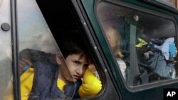 An ethnic Armenian boy from Nagorno-Karabakh looks on from a car upon arrival in Armenia's Goris, the town in Syunik region, Armenia. Thousands of Armenians have streamed out of Nagorno-Karabakh after the Azerbaijani military reclaimed full control of the breakaway region last week. (AP Photo/Vasily Krestyaninov)