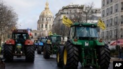 Farmers drive their tractors, Feb. 23, 2024, in Paris.