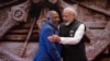 Indian Prime Minister Narendra Modi, right, shares a light moment with African Union Chairman and President of the Union of the Comoros Azali Assoumani upon his arrival for the G20 Summit in New Delhi, India, on Sept. 9, 2023.