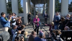 U.S. Ambassador to Russia Lynne Tracy, center, speaks to the media after hearing on Wall Street Journal reporter Evan Gershkovich's case at the Moscow City Court, in Moscow, Russia, Sept. 19, 2023.